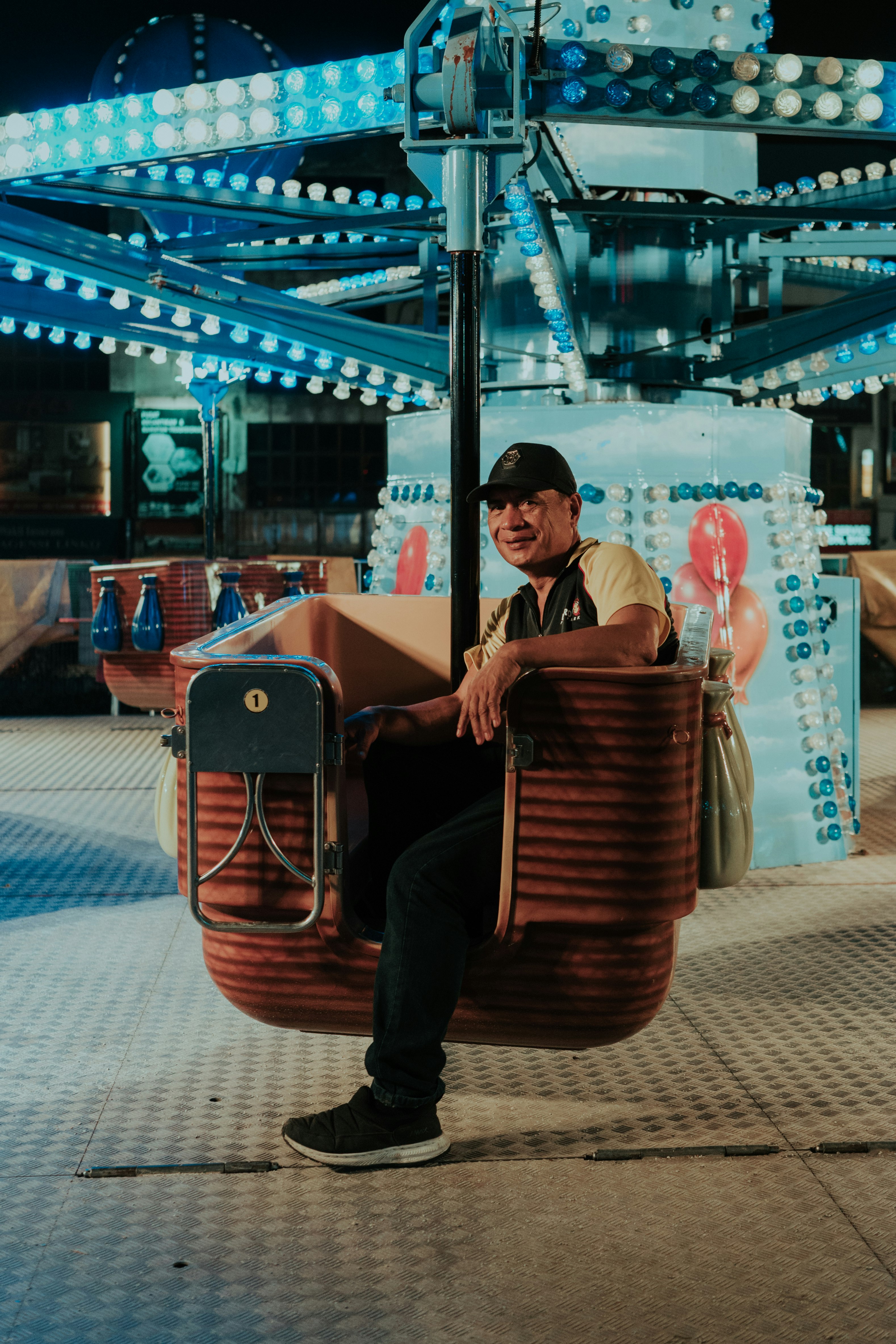 man riding circus ride